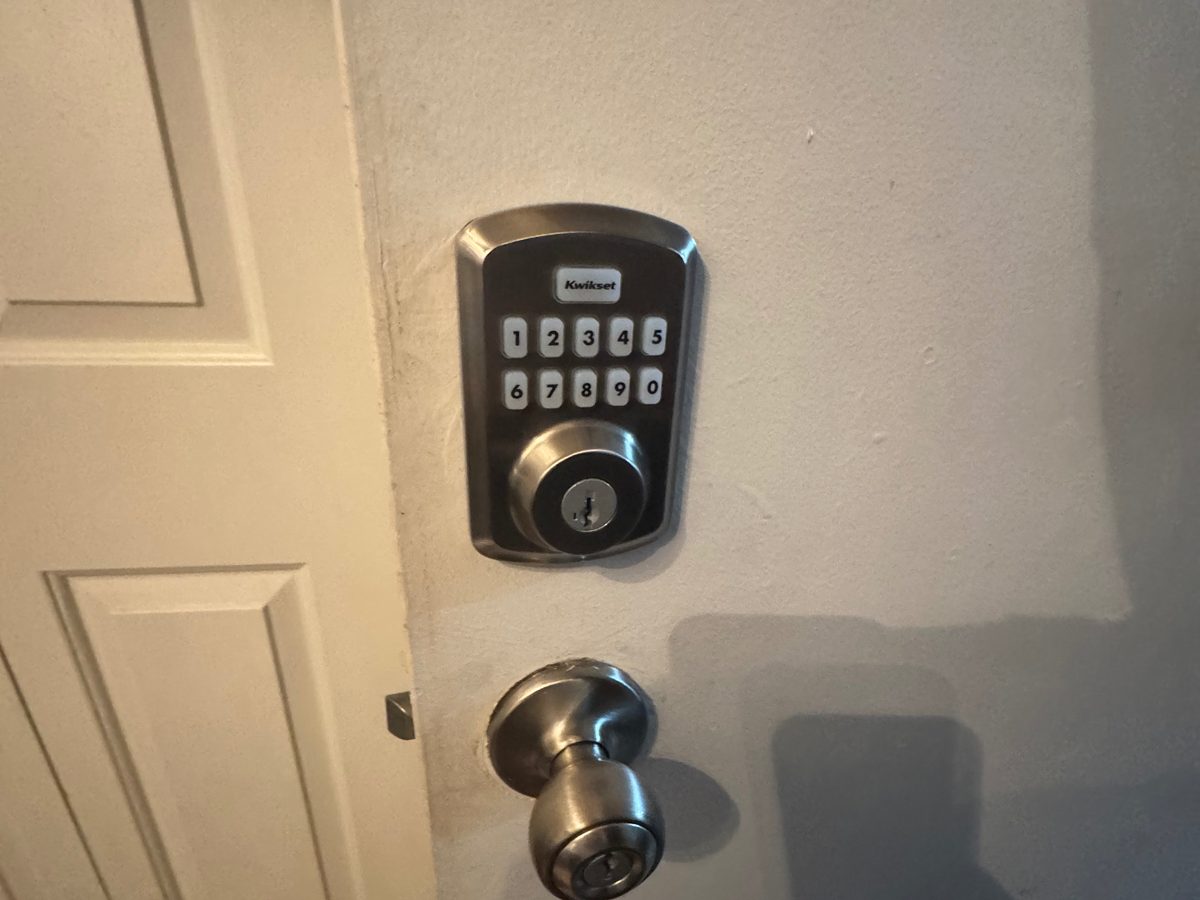 Kwikset electronic keypad deadbolt installed on a home door