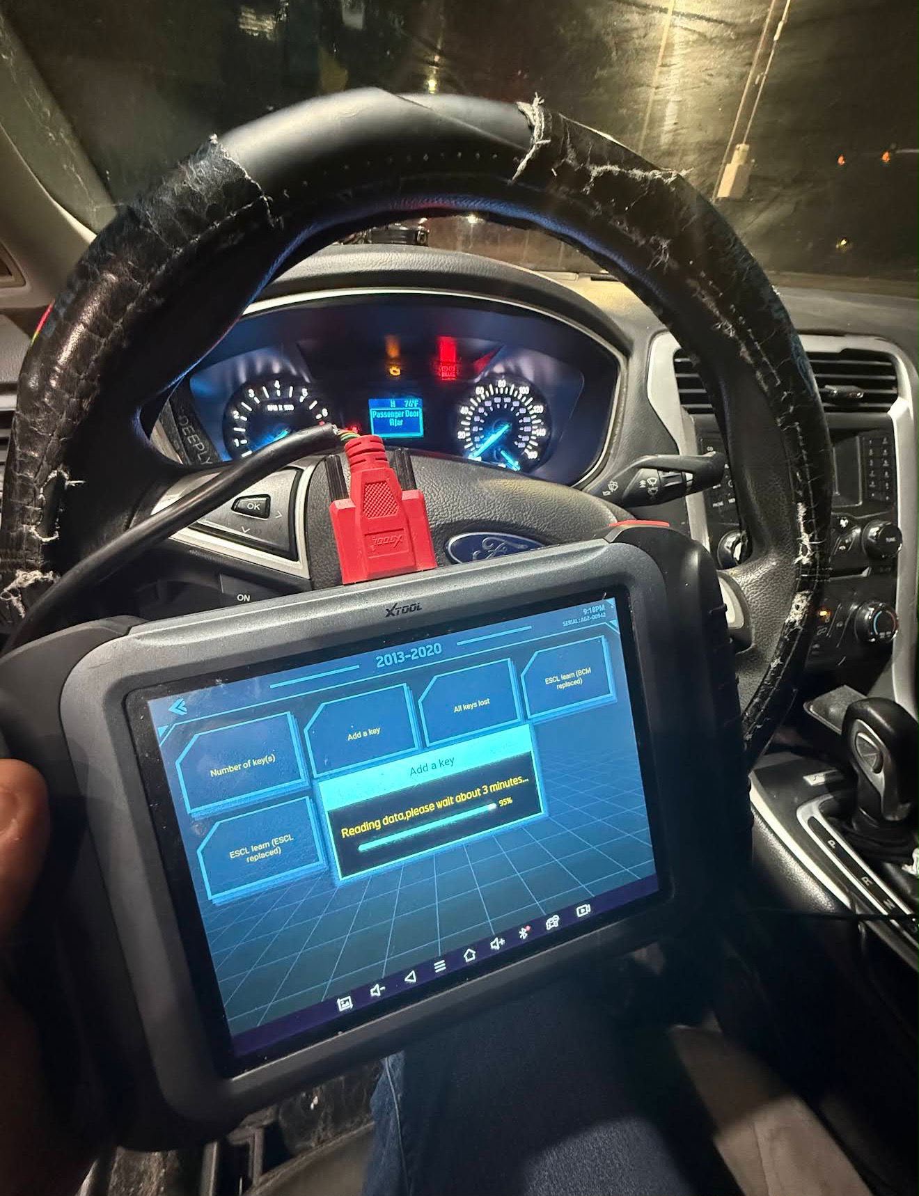 Transponder key being programmed in the mobile locksmith van