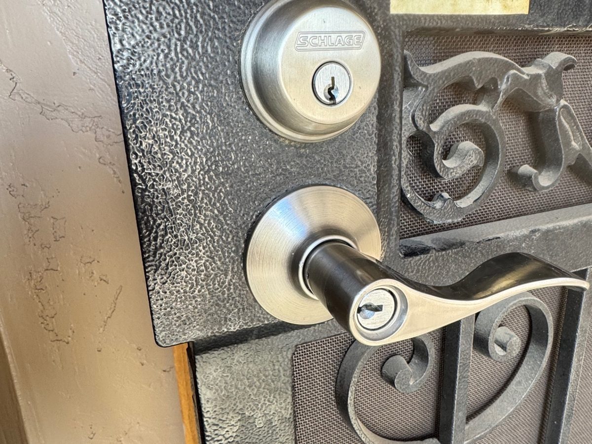 Schlage lever lock installed on a decorative metal security door