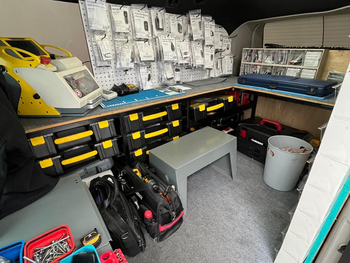 Locksmith workshop bench stocked with key blanks and cutting machines