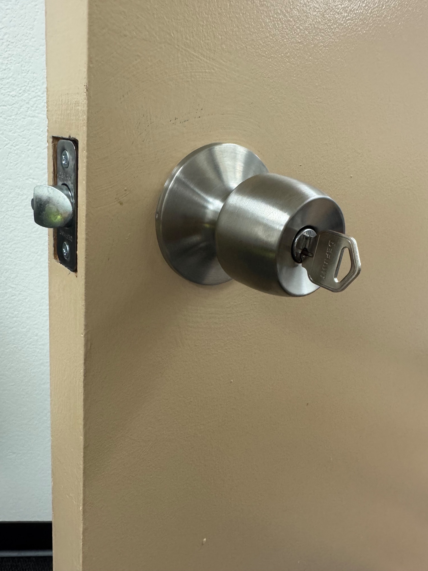 New lock hardware being installed on a home door